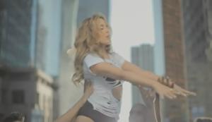 A screen shot from its music video. A screen shot from its music video.