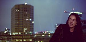 A screen shot from its music video. A screen shot from its music video.